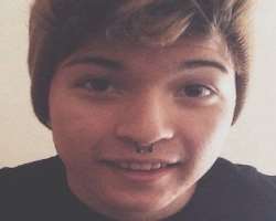 He has piercing in his nose septum and ears He has piercing in his nose septum and ears.
